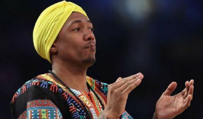 Nick Cannon in a yellow turban